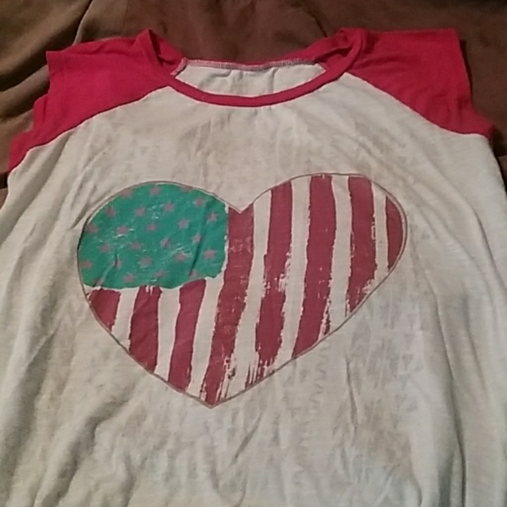 White shirt with flag on front with red sleeves